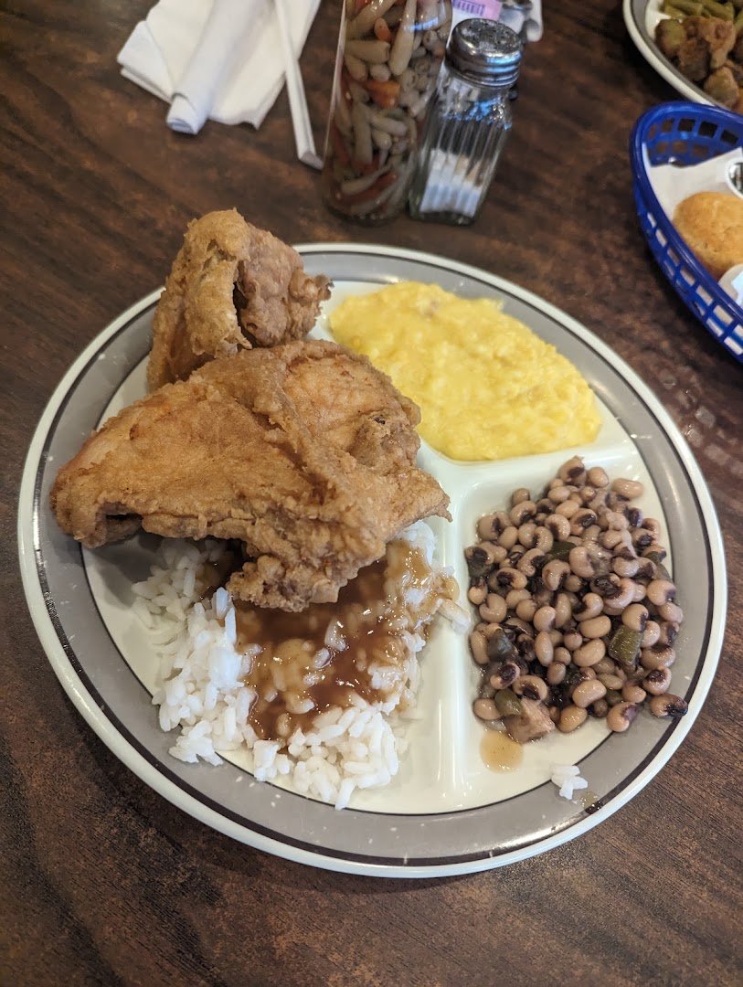 Plates of American comfort food on a table.